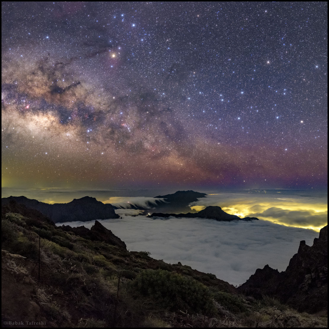 Rising Milky Way above cloud-filled Caldera de Taburiente National Park.